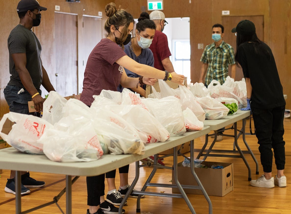 Volunteers organizing food on tables